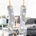 white and gray socks on brown wooden clothes hanger