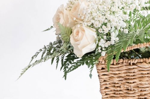 white flowers on brown woven basket