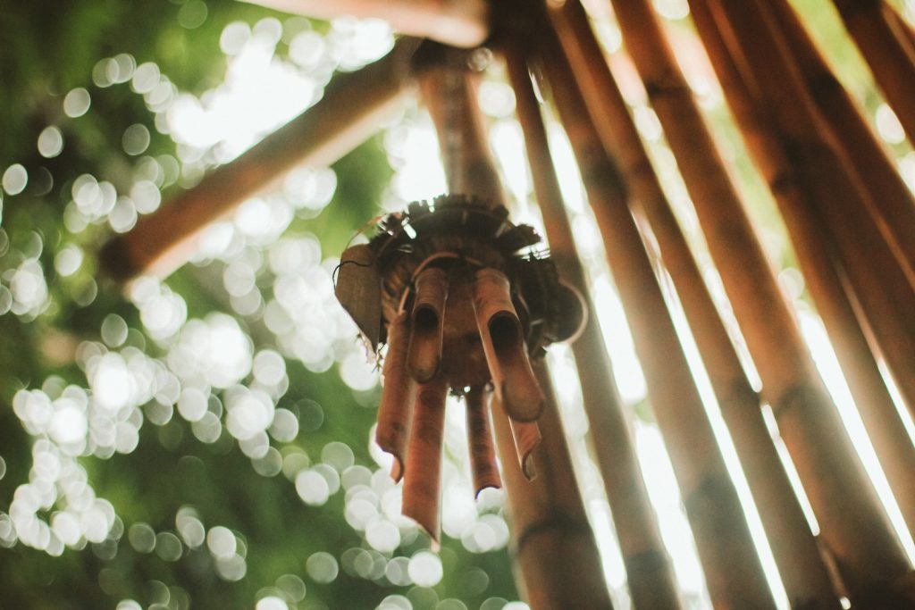 selective focus photography of wind chime
